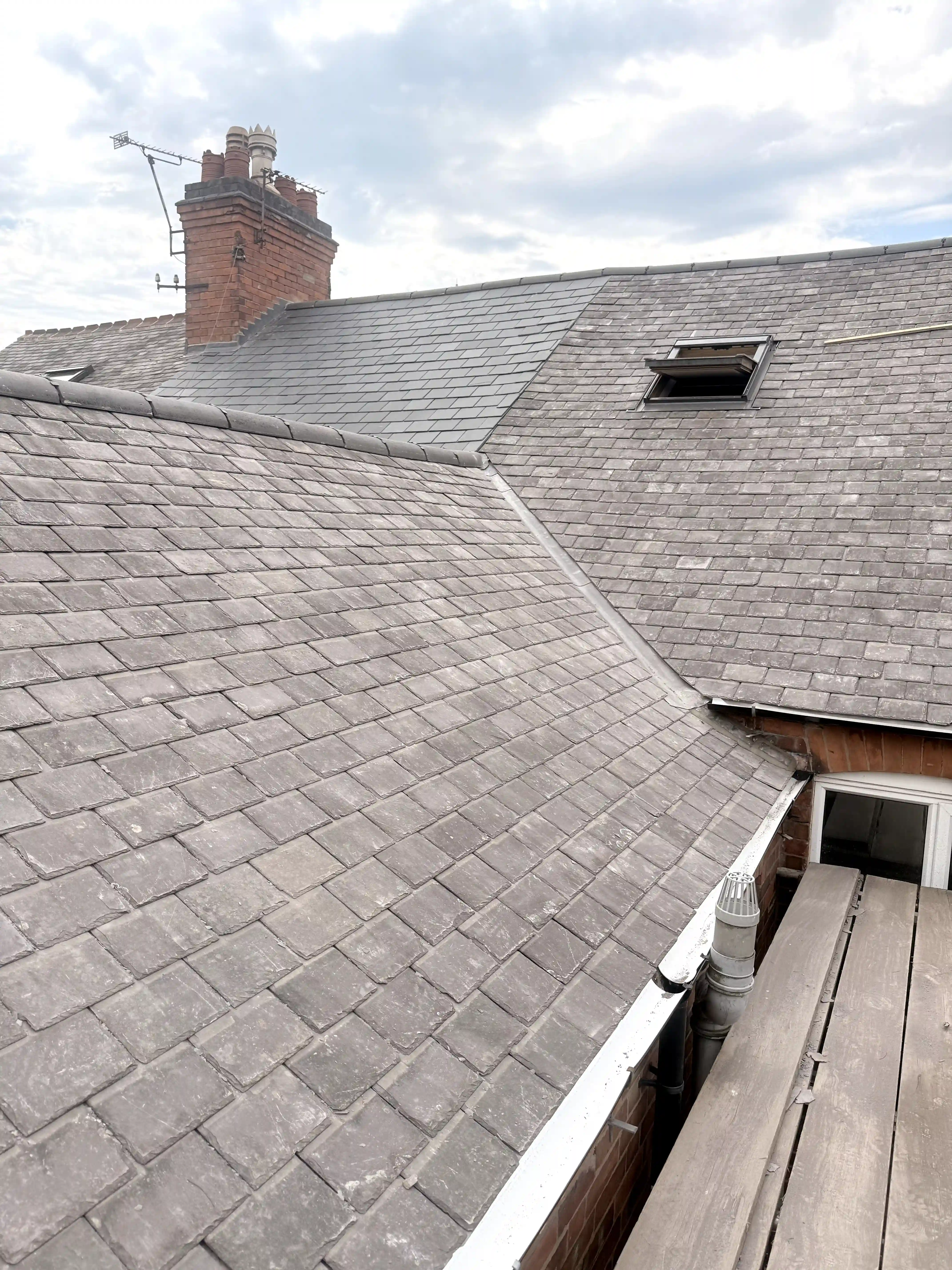 Victorian slate re-roof — hip valley and VELUX overview, Leicester