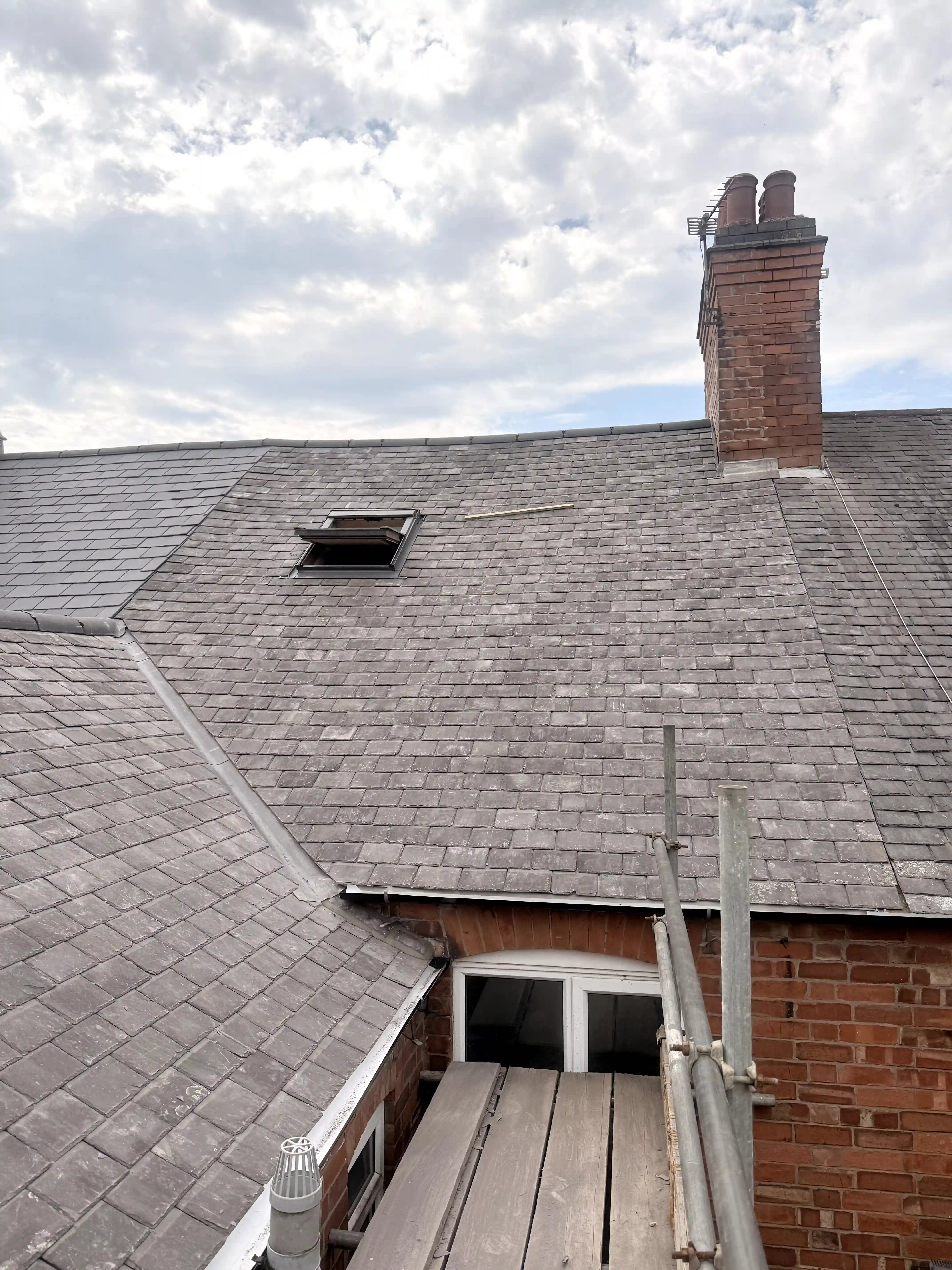 Victorian slate re-roof — lead valley and slate coursing detail