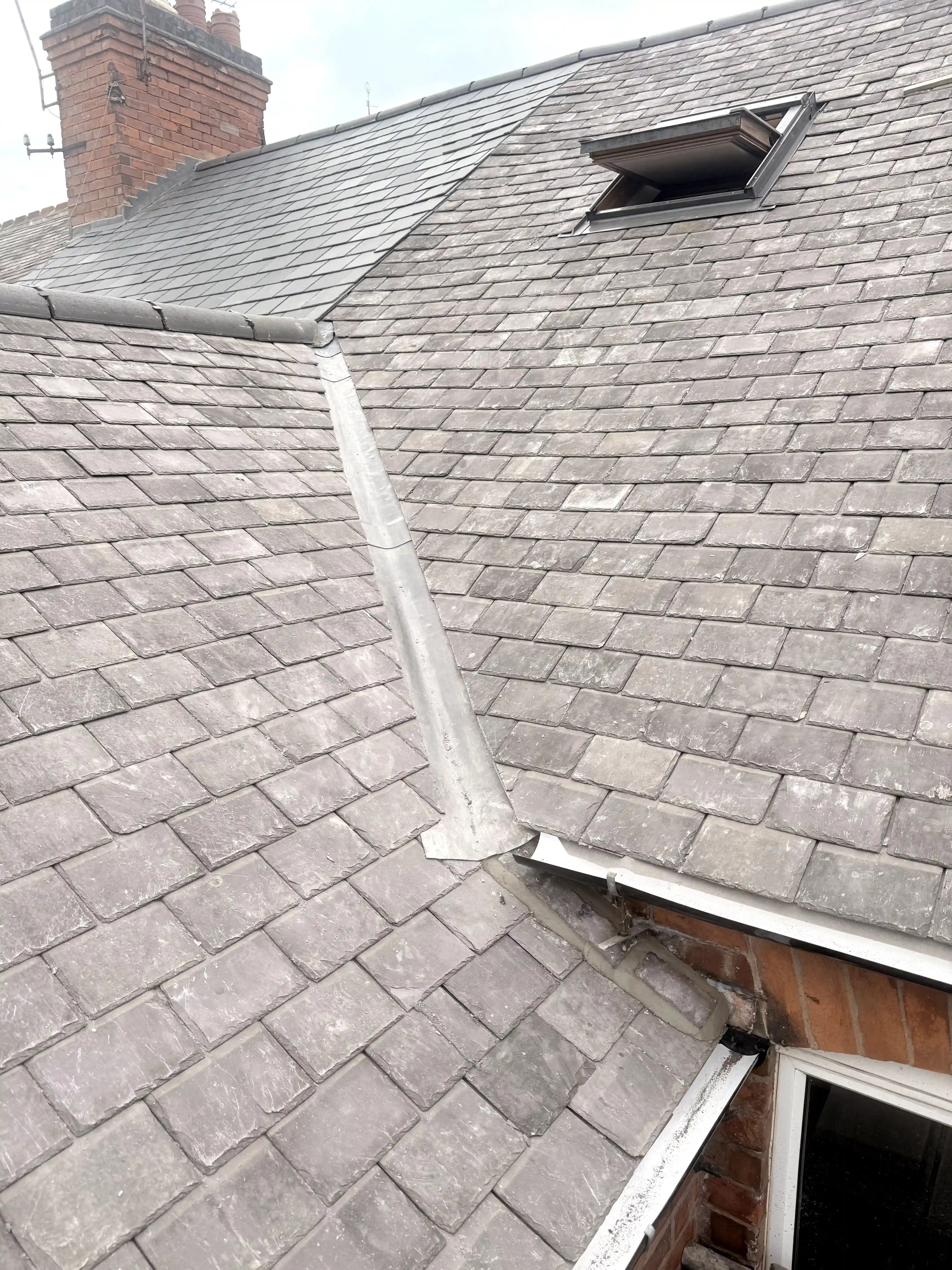 Victorian slate re-roof — valley lead flashing and VELUX window